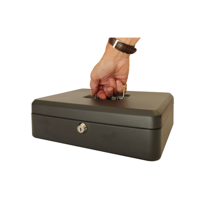 A hand lifting a 12-Inch key lockable matte black box by the handle, showing the size comparison between a hand and the size of the box.