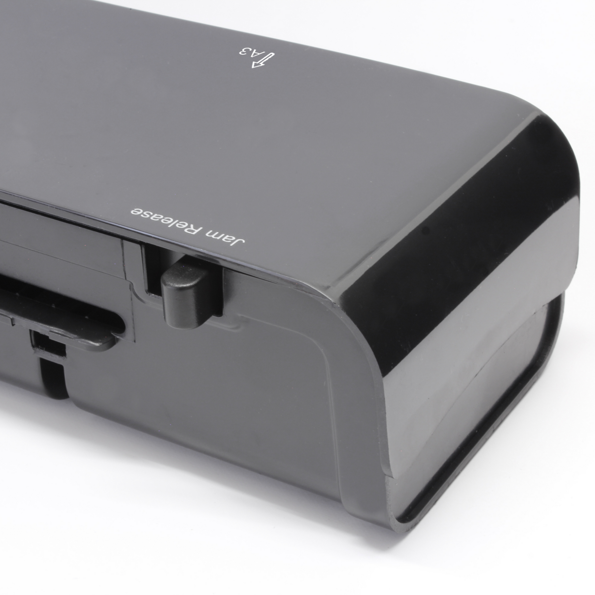 Side view of a Cathedral Products A3 laminator, featuring the jam release lever, emphasizing the device's sleek design and functionality for smooth laminating operations.