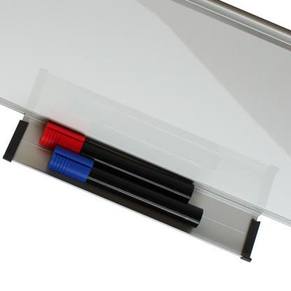 Whiteboard marker tray holding two markers with caps on, coloured red and blue, against a white magnetic board with a metallic frame.