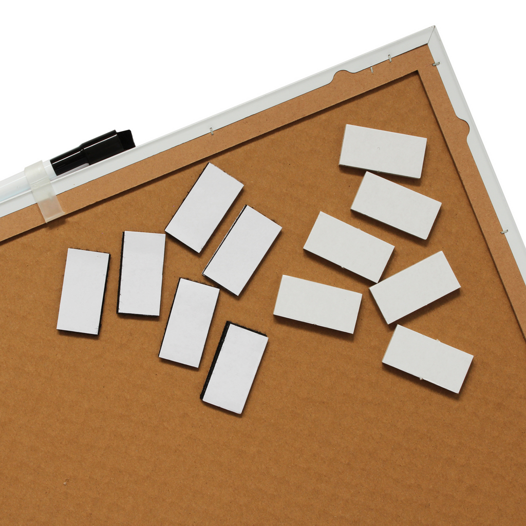 Rear of a frameless dry-erase board showing sturdy MDF backing, as well as reinforced edges, including white sticky pads scattered on the surface and a marker with an eraser attached to the top. The image shows the easy mounting ability of the boards.